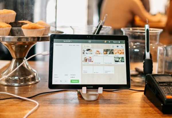 point of sale computer system for customers to pay, sitting on a cafe counter