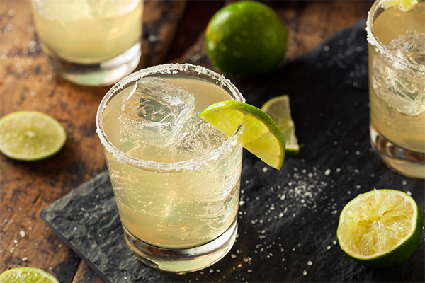 Classic Margarita recipe with fresh lime wedges