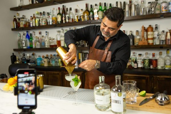 Bartender making a drink with a cocktail shaker