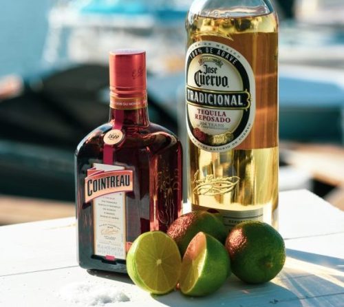 meaningful gift option: Margarita kit with fresh limes, Cointreau, and a bottle of tequila by YesMore Content via www.unsplash.com