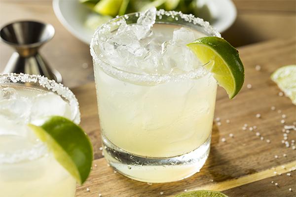 classic margarita without orange juice and a lime slice for a perfect cocktail