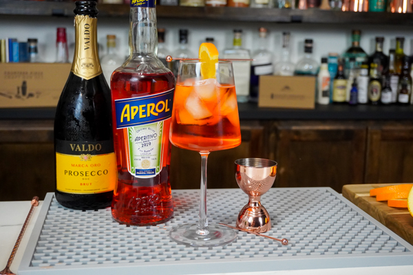 Aperol bottle and prosecco for classic cocktail