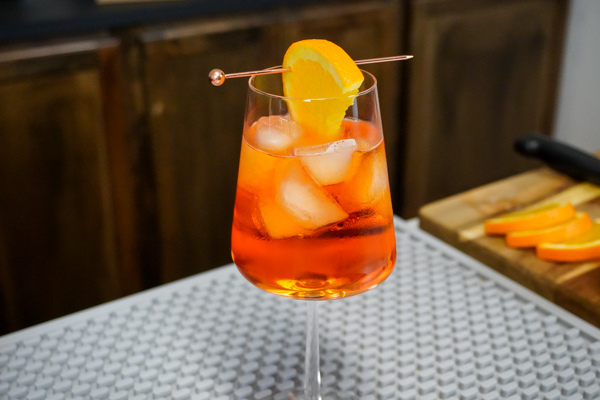 Aperol spritz refreshing cocktail with 4 ounces Prosecco and an orange slice