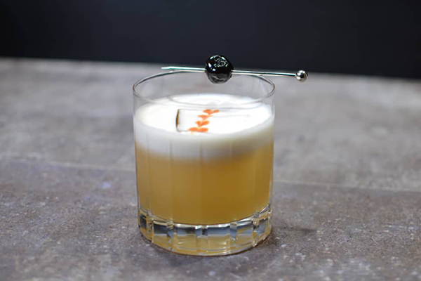 Whiskey Sour made with bitters eye dropper bottle