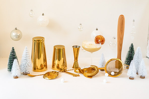 lovely gift of gold 14 piece cocktail shaker set for the holidays with an alcoholic cocktail