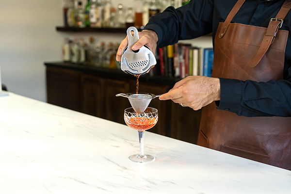 Small Fine Strainer pouring cocktail