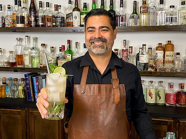 Bartender holding a cocktail glass with cuban cocktail