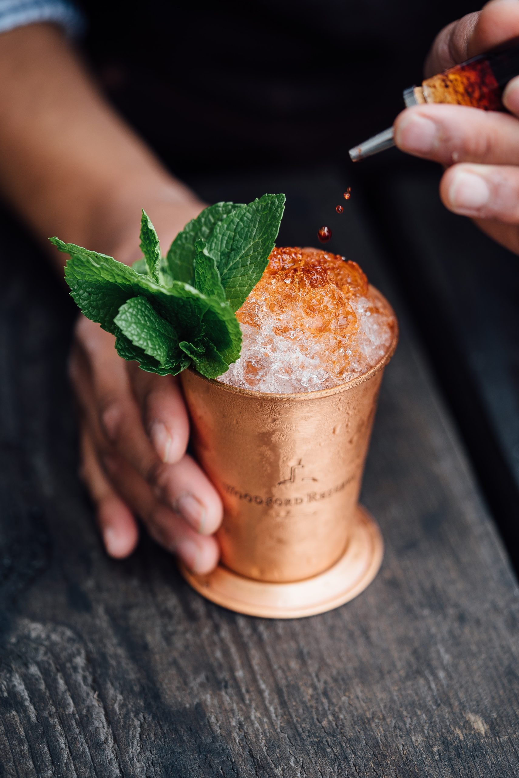 classic bourbon cocktail with sprigs of mint