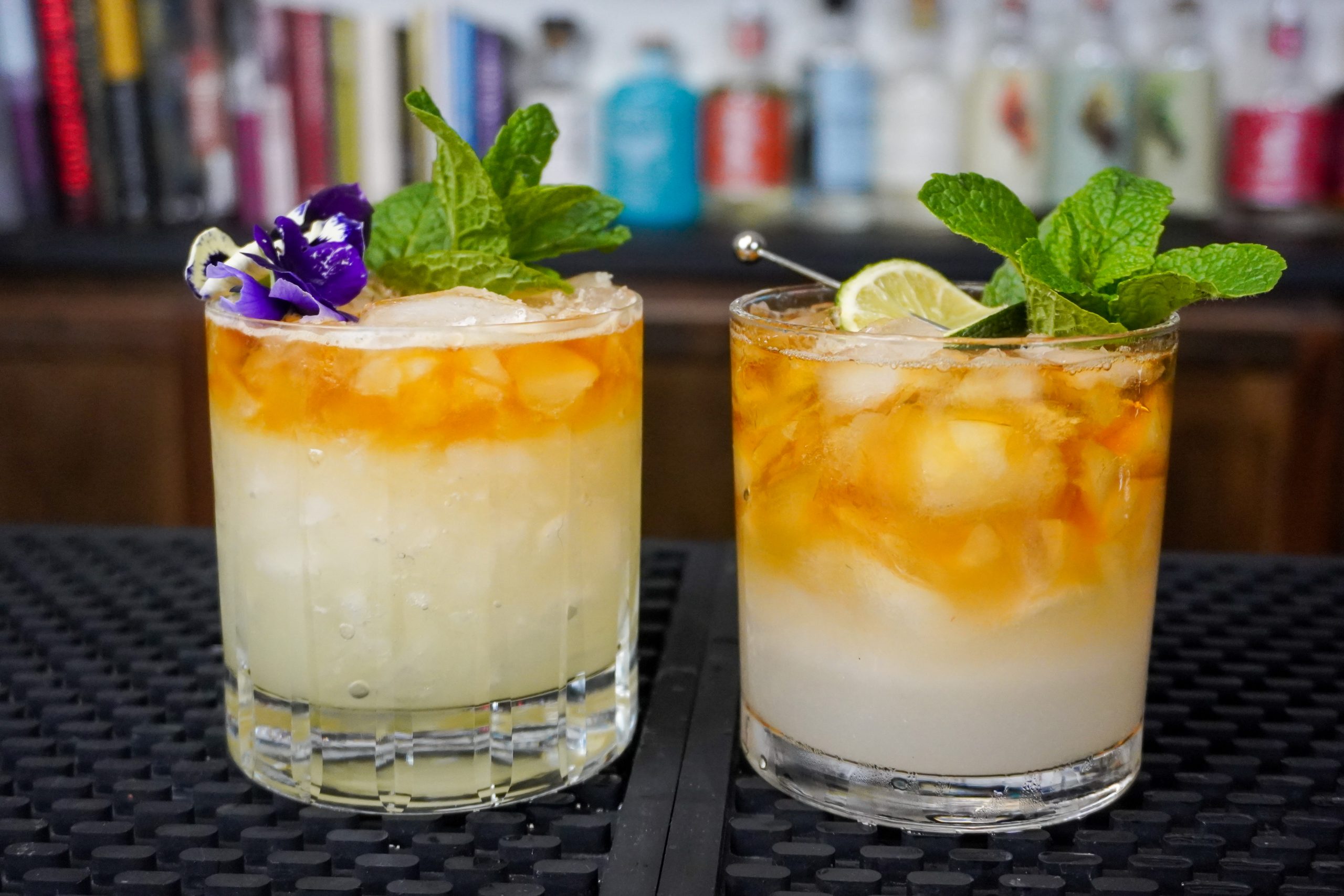 2. Mai Tai cocktails with 2 ounce dark rum, 1 ounce lime juice, and orange Curacao in a double old-fashioned glass each