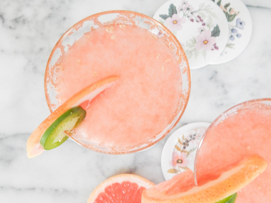 4. Paloma with topo chico brands of grapefruit soda in a 4. glass with ice cubes by Christine Trant via unsplash