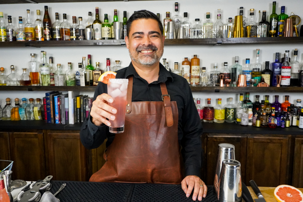 5. Bartender holding a favorite drink for summer with a pinch of salt on the rim of glass