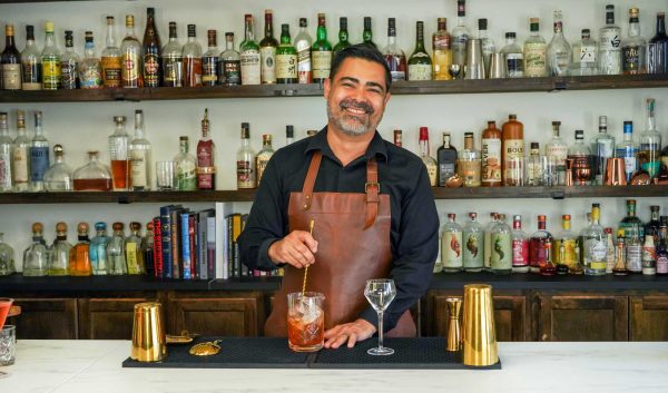 Chris Tunstall - A Bar Above Founder, mixing a cocktail with complex flavour