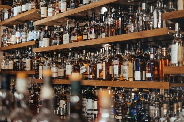 extra stock of additional inventory of liquor on a bar shelf.