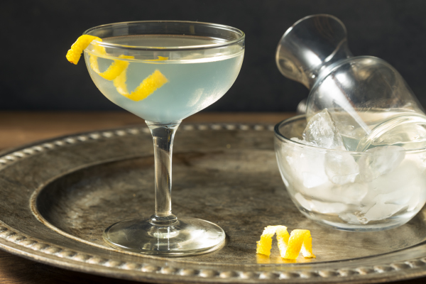 cocktail with strip of lemon peel