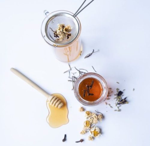 floral honey with a cocktail strainer