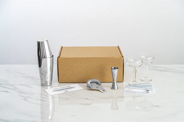 at home date night idea box with 2 glasses, a Boston shaker, Hawthorne strainer, jigger, and recipe cards, perfect over a candlelit dinner